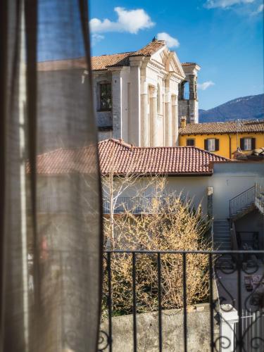 a view of a building from a balcony at La Maison Du Lac Iseo in Predore