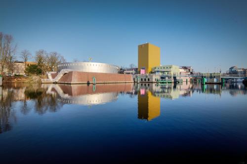 a marina filled with lots of water next to a body of water at City Hotel Groningen in Groningen