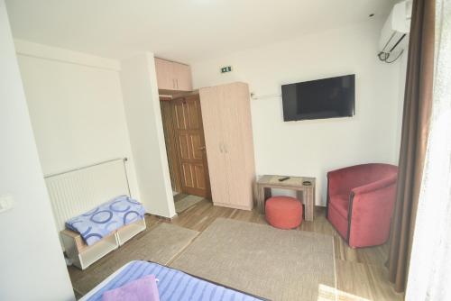 a living room with a couch and a chair at PRENOCISTE BAMBI in Vranje