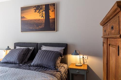 Katil atau katil-katil dalam bilik di Boutique Hotel Herberg Binnen