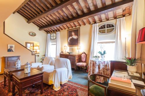 a living room with a couch and a table at Villa Abbazia Relais & Chateaux in Follina