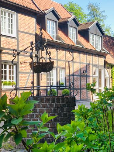 a house with a basket in front of it at Landhaus Eggert in Münster