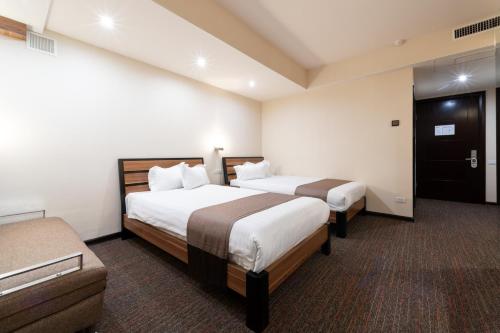 Ένα ή περισσότερα κρεβάτια σε δωμάτιο στο Bass Boutique Hotel