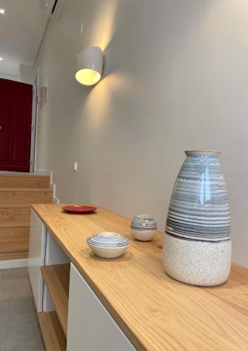 a large vase sitting on a counter in a kitchen at Cardeal Suites & Apartments in Faro