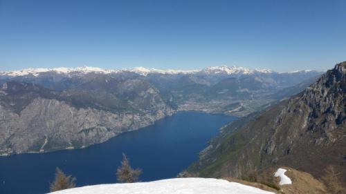 a view of a lake in the mountains at Pietra Rara Apartments in Pietramurata
