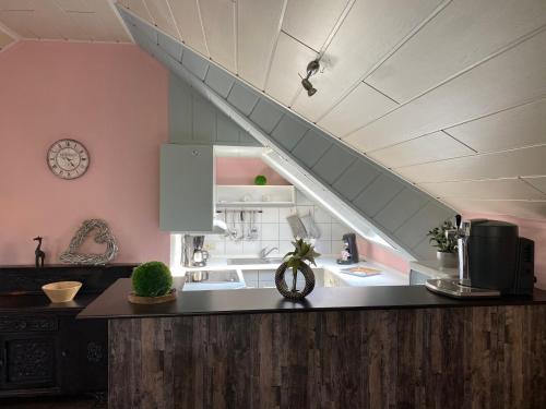 a kitchen with a counter top and a staircase at Pistenblick in Willingen