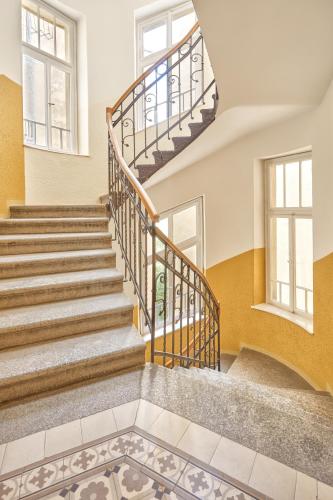a staircase in a home with a stair case at Lyra Apartments in Karlovy Vary