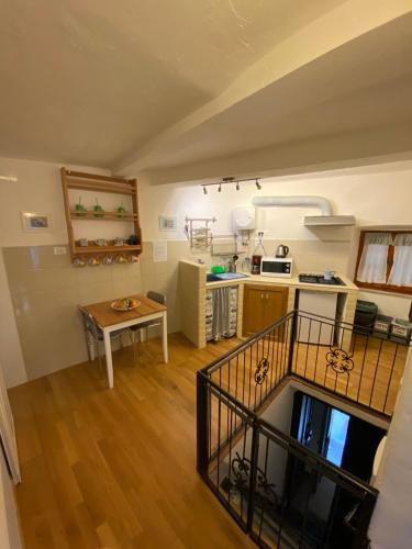 a large kitchen with a table and a tableablish at La Dinette Riomaggiore in Riomaggiore