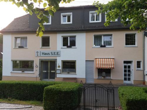 a house with a sign that reads i have see at Haus S.E.E. in Marienthal