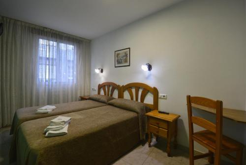 Katil atau katil-katil dalam bilik di Hotel Marín