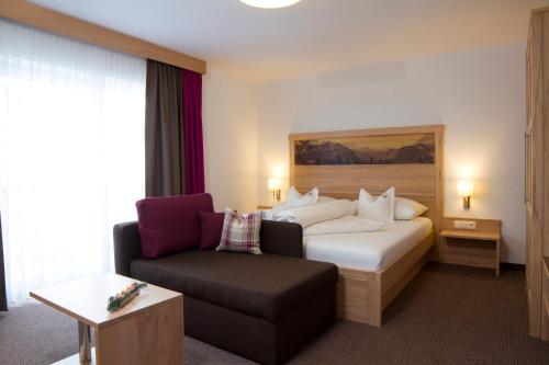 Postel nebo postele na pokoji v ubytování Alpinhotel Monte Superior - Silvretta Card Premium Betrieb