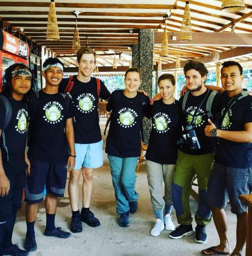 a group of men wearing shirts with trees on them at Gino's Place - Guest House & Jungle Trekking in Bukit Lawang