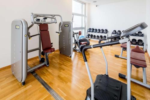 a gym with treadmills and exercise equipment at Best Western Premier BHR Treviso Hotel in Quinto di Treviso