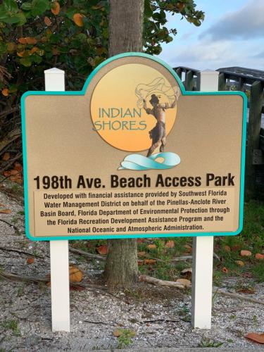 a sign for an entrance to the beach access park at Sea Club Condo #37 in Clearwater Beach