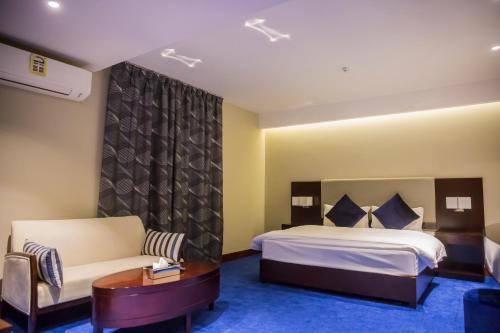 Ένα ή περισσότερα κρεβάτια σε δωμάτιο στο Al Aryam Serviced Aparthotel