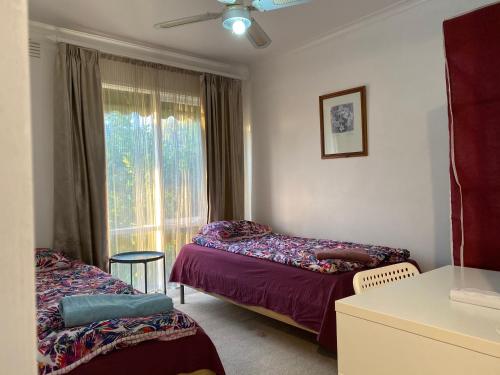 Postel nebo postele na pokoji v ubytování ADA Homestay