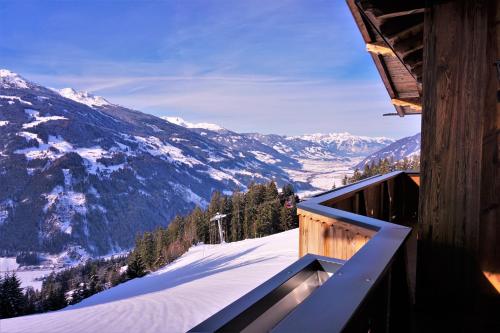 a balcony with a view of a snow covered mountain at Apartment Alpenstyle by Katharina in Zell am Ziller