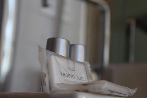 a container of lipstick sitting on top of a counter at B&B Pescara Centro Luxury Suite in Pescara