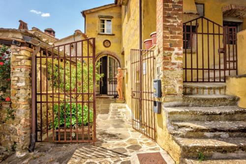 an entrance to a house with an iron gate at Borgo Marcena in Arezzo