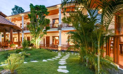 a house with a garden in front of it at Bungalow Sáng Tươi Mountains in Phu Quoc