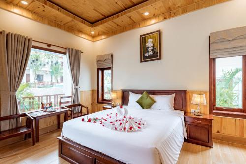 En eller flere senge i et værelse på Bungalow Sáng Tươi Mountains