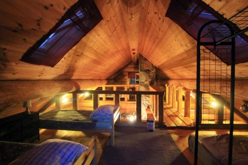 a large room with two bunk beds in it at Excellent log house with a sauna in Lahemaa! in Hara