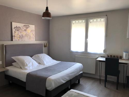 Postel nebo postele na pokoji v ubytování Hôtel Du Viaduc