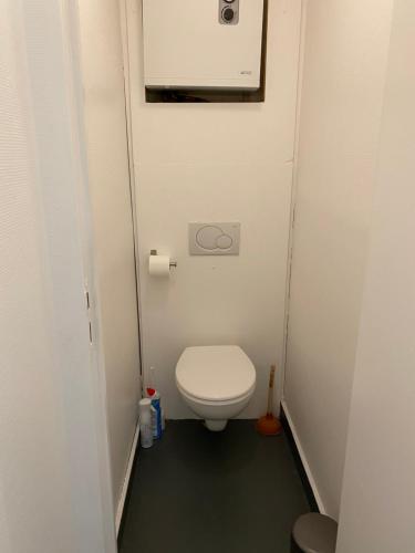 a small bathroom with a toilet in a stall at Artistic apartment center of Paris in Paris