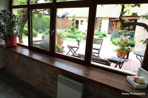 a window with a view of a patio at Maksimilian Osijek in Osijek