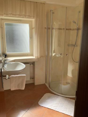 a bathroom with a shower and a sink at Hotel Wintersmühle in Bielefeld