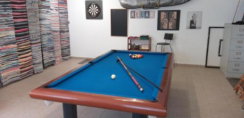 a pool table with a ball and a cue at FIND Your Space Casa no Campo - Paderne - Albufeira - Piscina Privada - Aquecida a pedido in Paderne