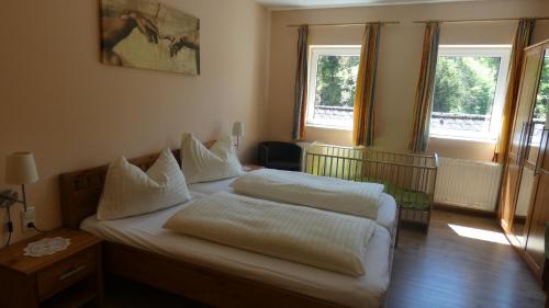 מיטה או מיטות בחדר ב-Ferienhaus an der Ybbs