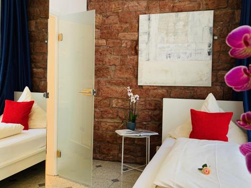 Postel nebo postele na pokoji v ubytování Hotel B54 Heidelberg City Center