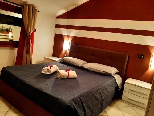 a bedroom with a bed with two towels on it at Risorgimento in Avezzano