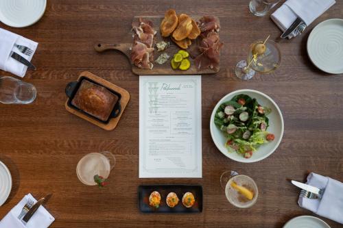 a table with a bowl of food and a plate of food at Crowne Plaza Atlanta Perimeter at Ravinia by IHG in Atlanta