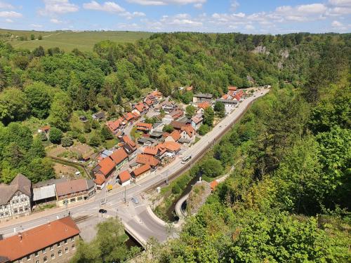 an aerial view of a small town with a road at Numero1-Pension und Cafe in Rübeland