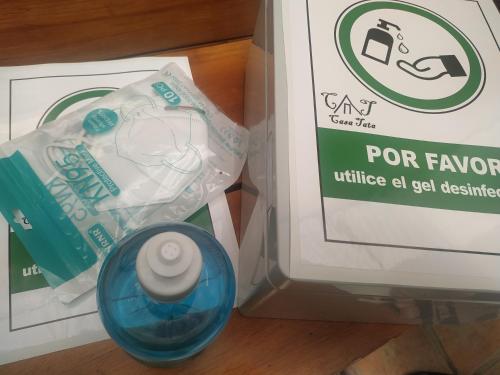 a box with a bottle of cleaning product next to a sign at Casa Tata in Tijarafe