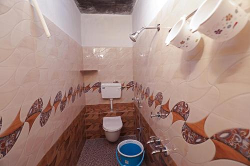 a bathroom with a toilet in a room at Laila Palace in Salem