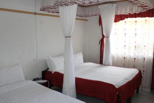 Ein Bett oder Betten in einem Zimmer der Unterkunft Salient Guest House