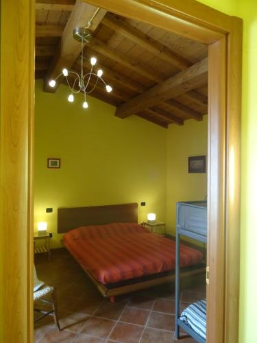 Säng eller sängar i ett rum på La Fattoria al Crocefisso