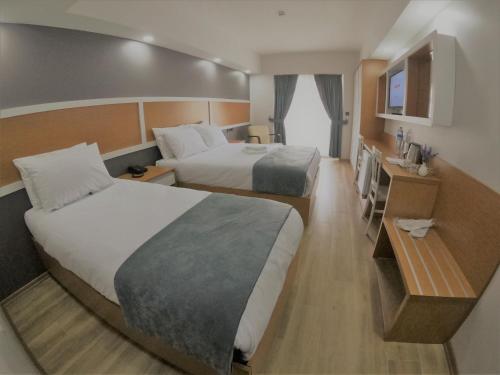 Katil atau katil-katil dalam bilik di ASİWA HOTEL