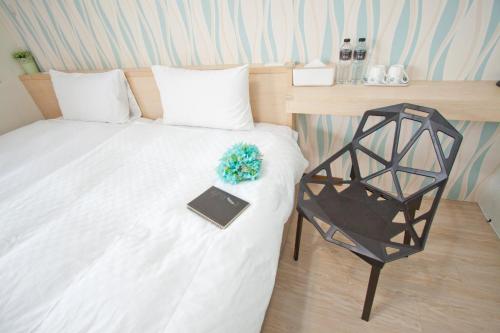 Ein Bett oder Betten in einem Zimmer der Unterkunft Dons Young Homestay