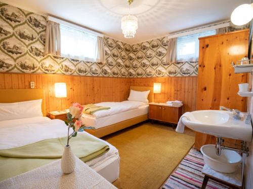 Ένα ή περισσότερα κρεβάτια σε δωμάτιο στο Gästehaus Pension Ria