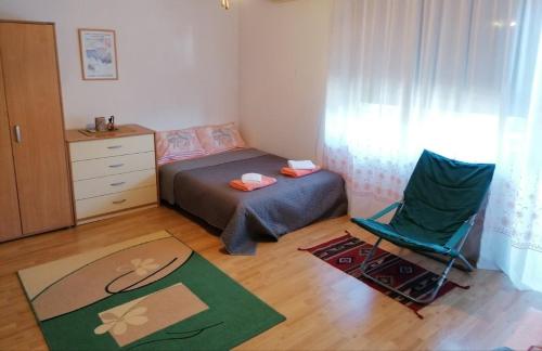 Postel nebo postele na pokoji v ubytování Apartman Santos