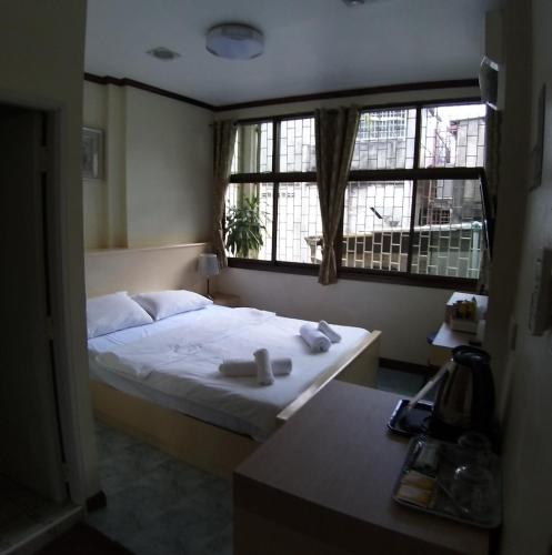 Ένα ή περισσότερα κρεβάτια σε δωμάτιο στο Linda rooms
