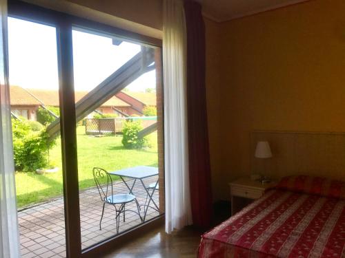 Postel nebo postele na pokoji v ubytování Serravalle Golf Hotel
