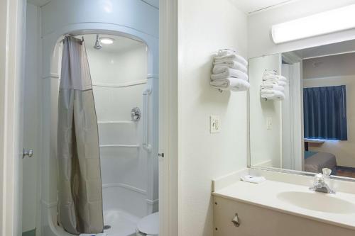a bathroom with a shower and a sink at Motel 6 Fredericksburg, Va - North in Fredericksburg
