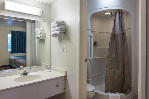 a bathroom with a sink and a shower and a toilet at Motel 6 Fredericksburg, Va - North in Fredericksburg