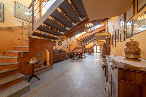 a large hallway with a staircase in a building at Wine-Farm La Source in Saint-Pierre