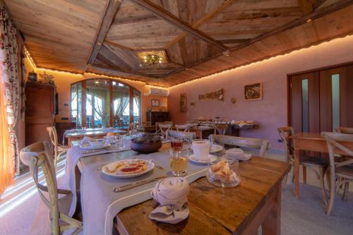 a dining room with a table with food on it at Wine-Farm La Source in Saint-Pierre